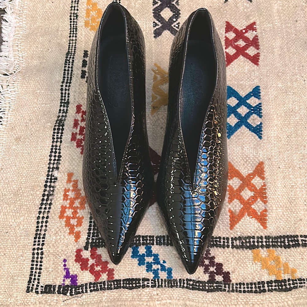 Patent leather V cut block heels.